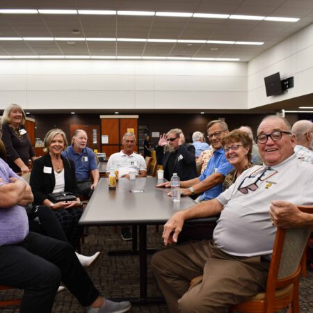 a group of people sitting around a table