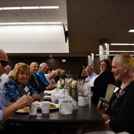 a group of people sitting at a table