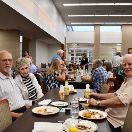 a group of people eating at a table