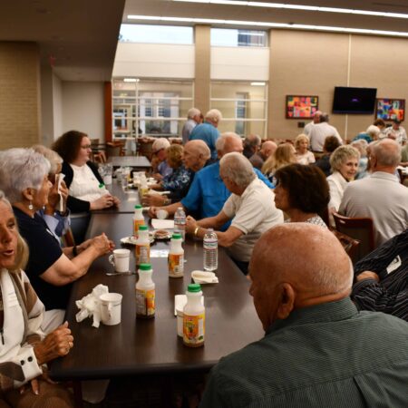 a group of people sitting at tables