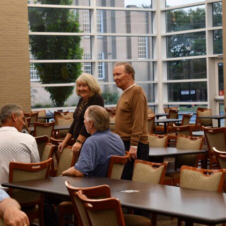 a group of people sitting around tables