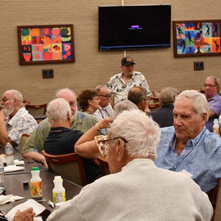 a group of people sitting at a table