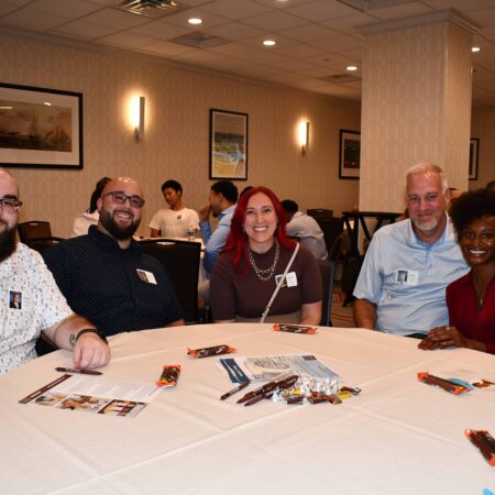a group of people sitting at a table