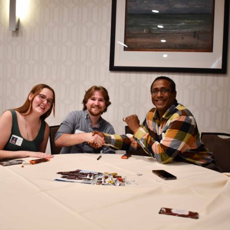 a group of people sitting at a table