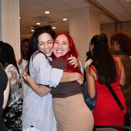 two women hugging each other