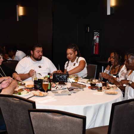 a group of people sitting around a table