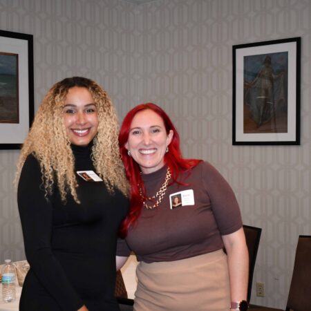 two women smiling at the camera