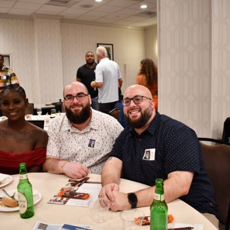 a group of people sitting at a table