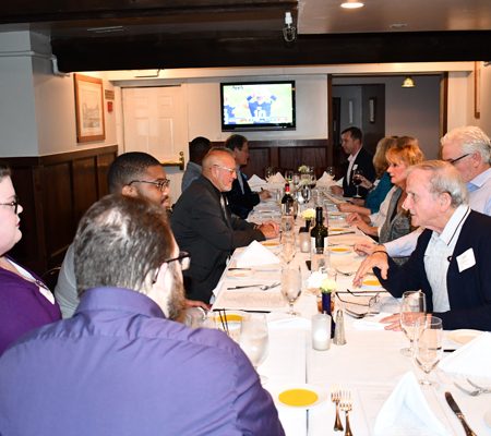 a group of people sitting at a table