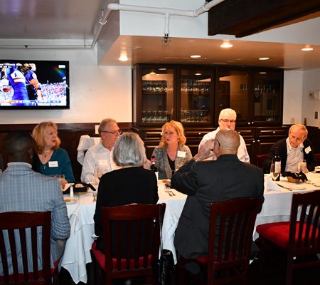 a group of people sitting at a table