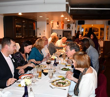 a group of people sitting at a table