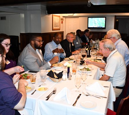 a group of people sitting at a table