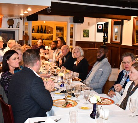 a group of people sitting at a table