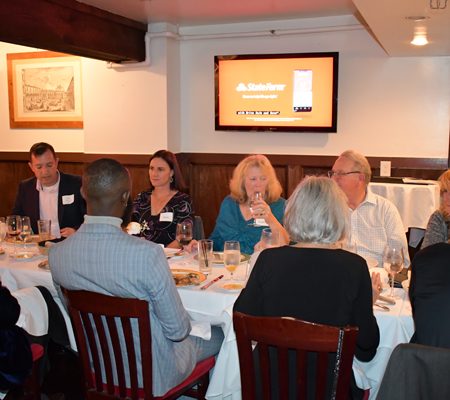 a group of people sitting at a table
