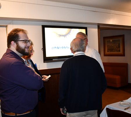 a group of people standing in a room