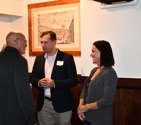 a group of people standing in a room