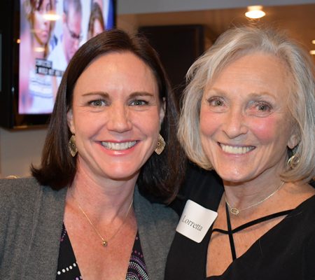 a couple of women smiling