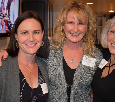 a group of women smiling at the camera