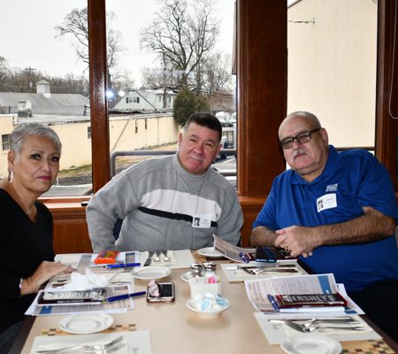 a group of people sitting at a table