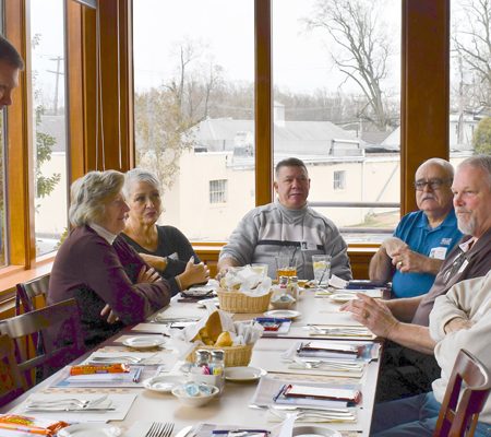 a group of people sitting at a table