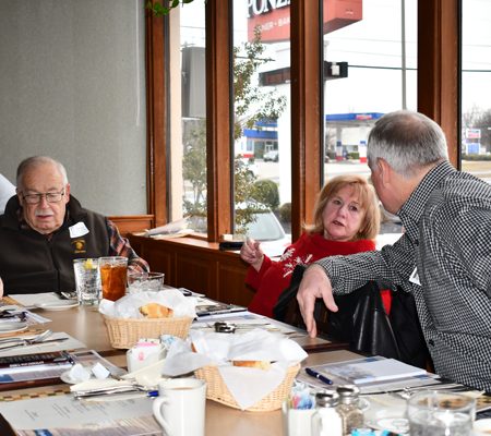 a group of people sitting at a table