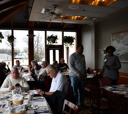 a group of people sitting at tables