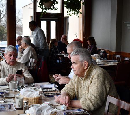 a group of people sitting at a table