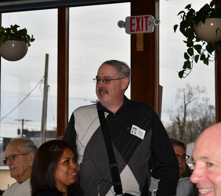 a person standing in front of a group of people