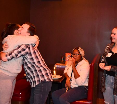 a group of people kissing