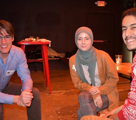 a group of people sitting on the floor