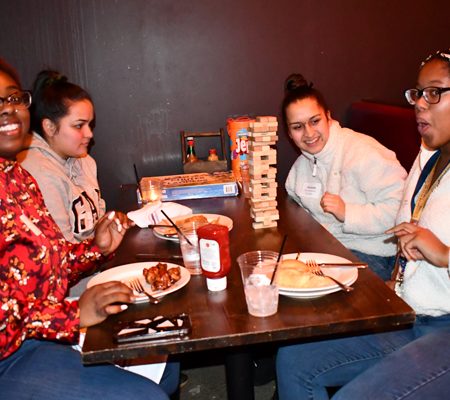 a group of people sitting at a table