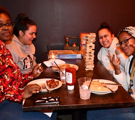 a group of women sitting at a table