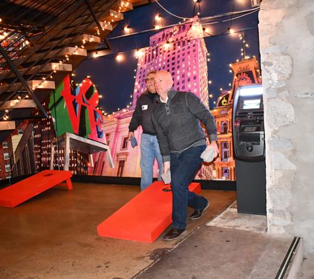 a person standing next to a red object