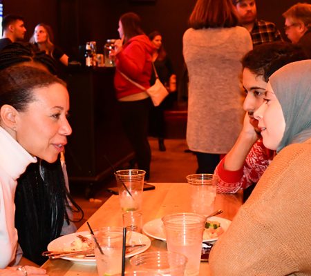 a group of people sitting at a table