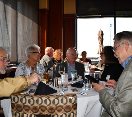 a group of people sitting at a table