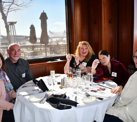 a group of people sitting at a table