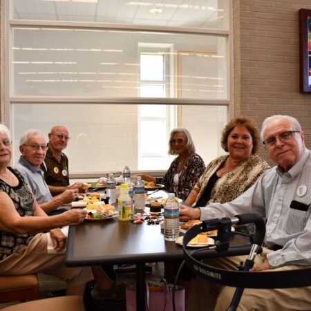 a group of people sitting at a table