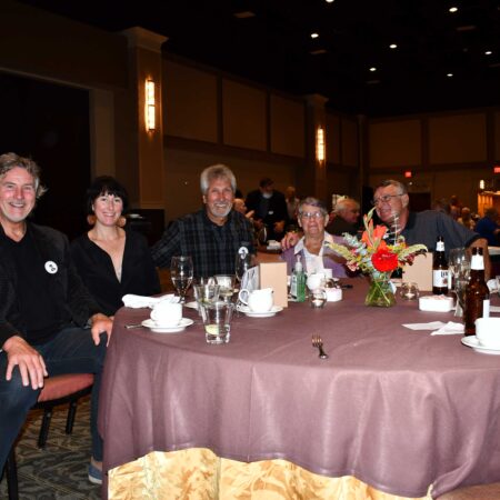 a group of people sitting at a table
