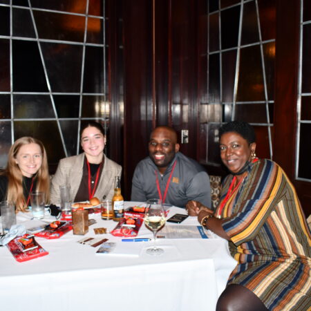 a group of people sitting at a table
