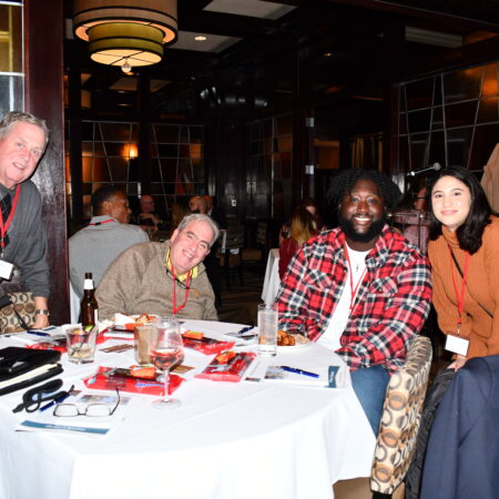 a group of people sitting at a table