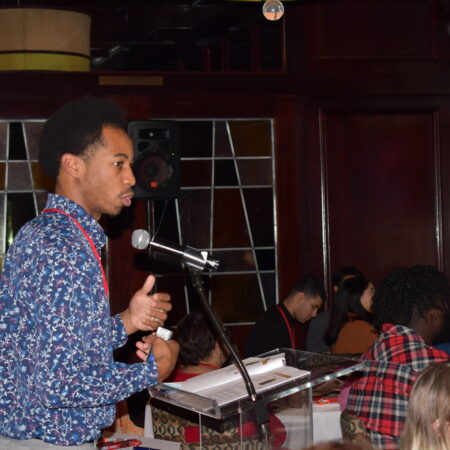 a person speaking into a microphone
