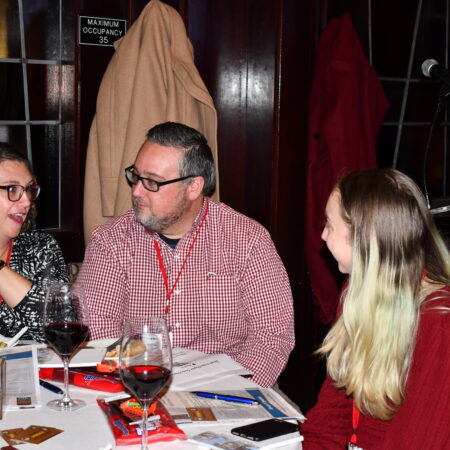 a group of people sitting at a table