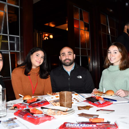 a group of people sitting at a table
