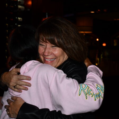 a person hugging another person