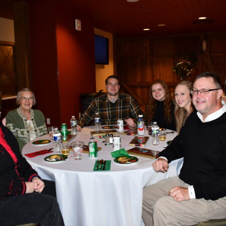 a group of people sitting around a table