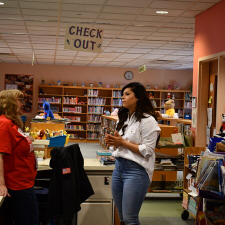 a person standing in a library