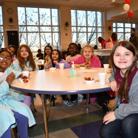a group of people sitting at a table