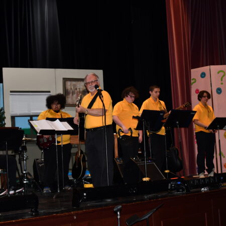 a group of people performing on a stage