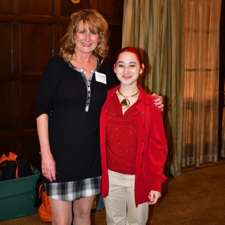 a person standing next to a person