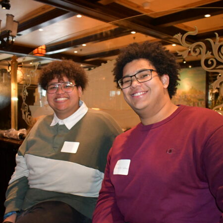 a couple of men sitting in a bar